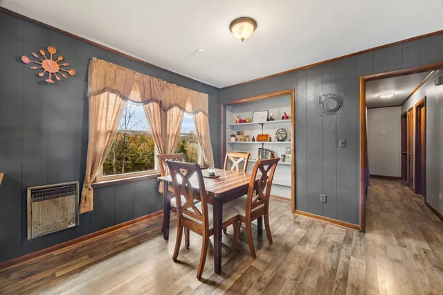 a bathroom with a granite countertop toilet sink and mirror
