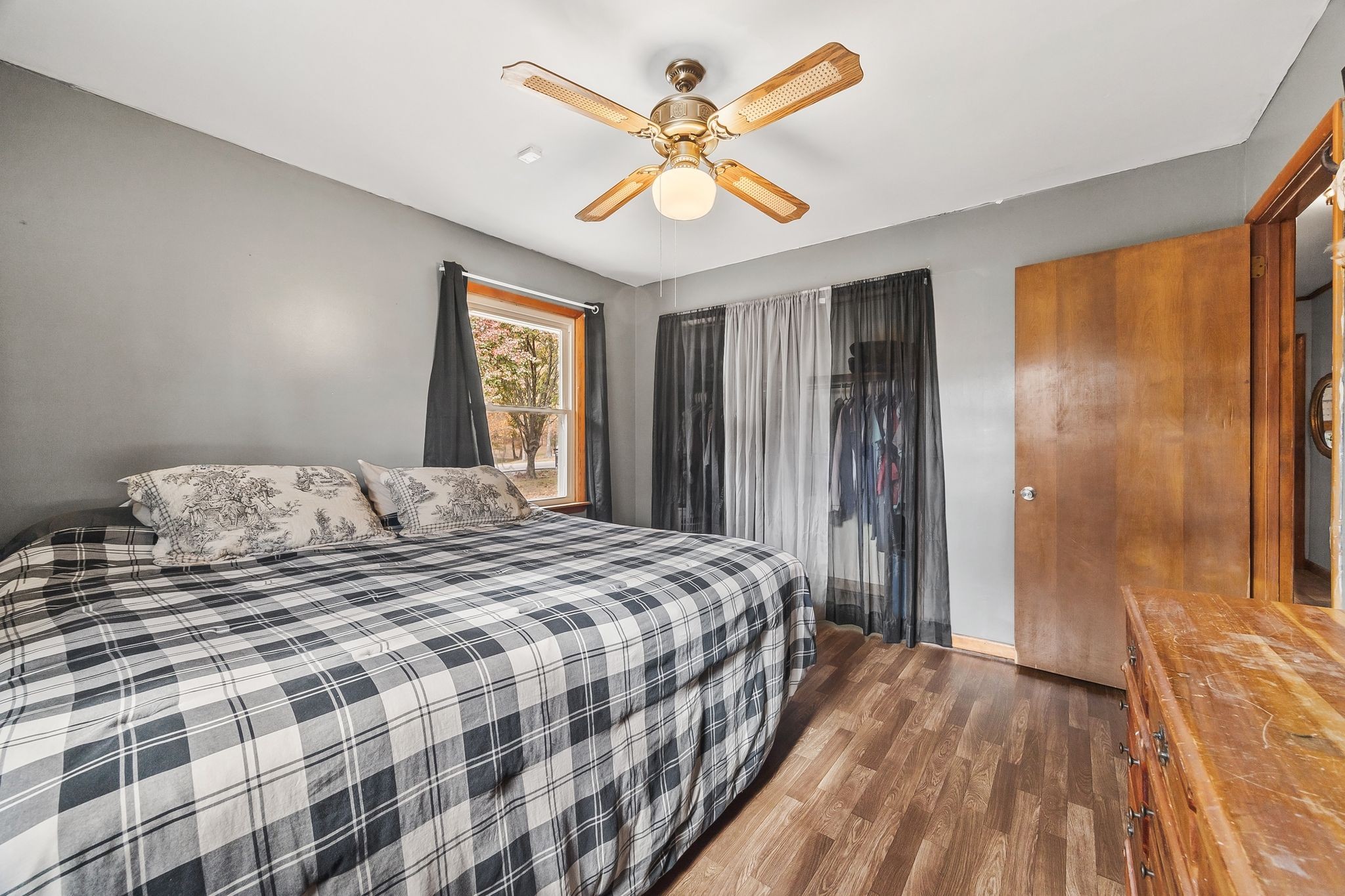 948 North Brace Road Summertown, TN 38483 - Photo 23 of 59 a bedroom with a large bed a chandelier and a window