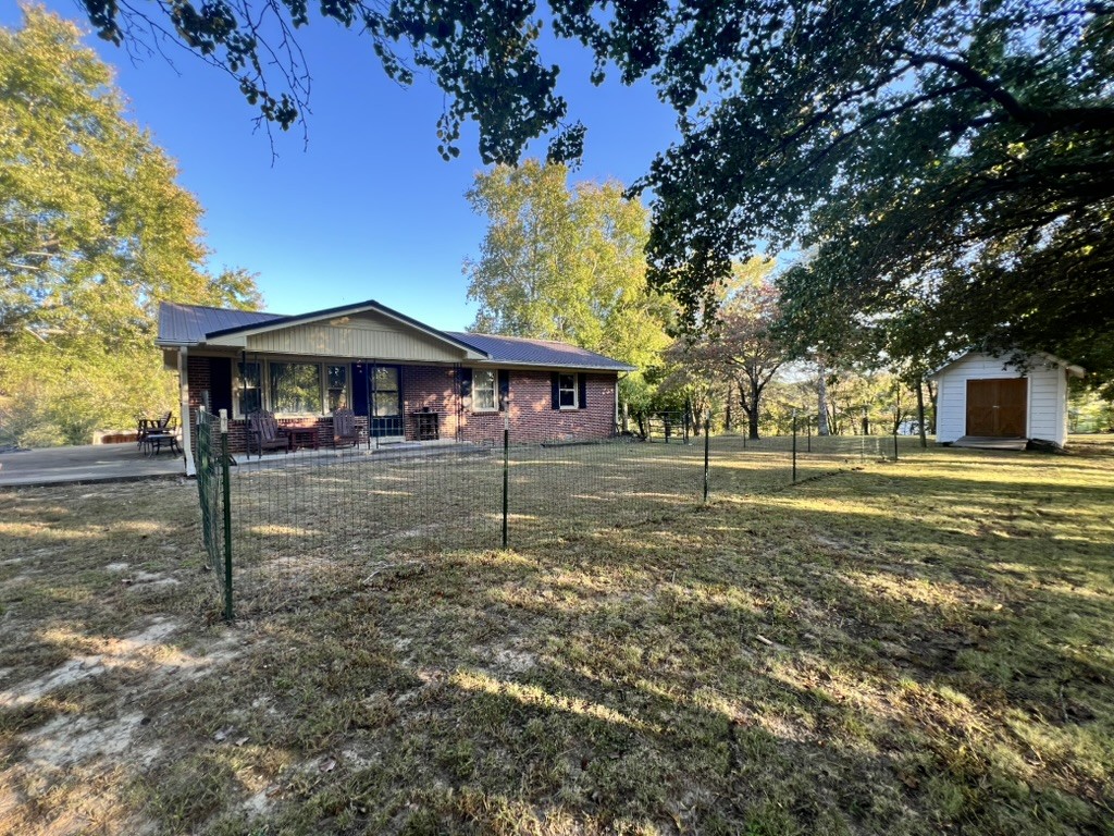 948 North Brace Road Summertown, TN 38483 - Photo 37 of 59 a front view of a house with a yard