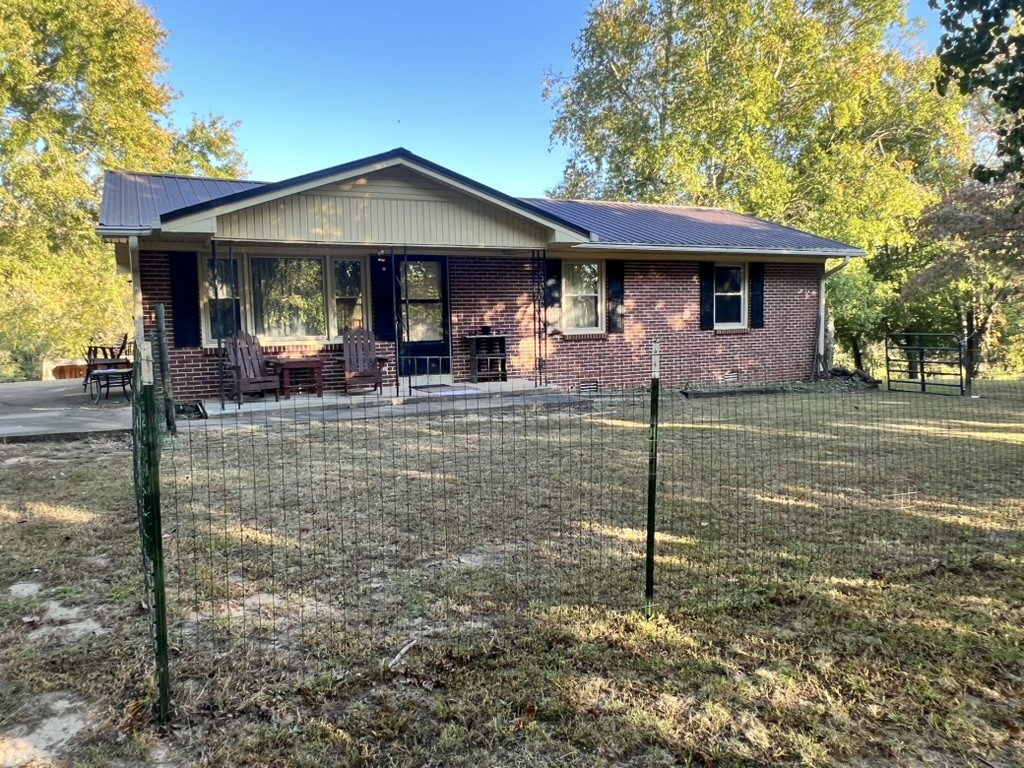 948 North Brace Road Summertown, TN 38483 - Photo 39 of 59 a front view of a house with garden