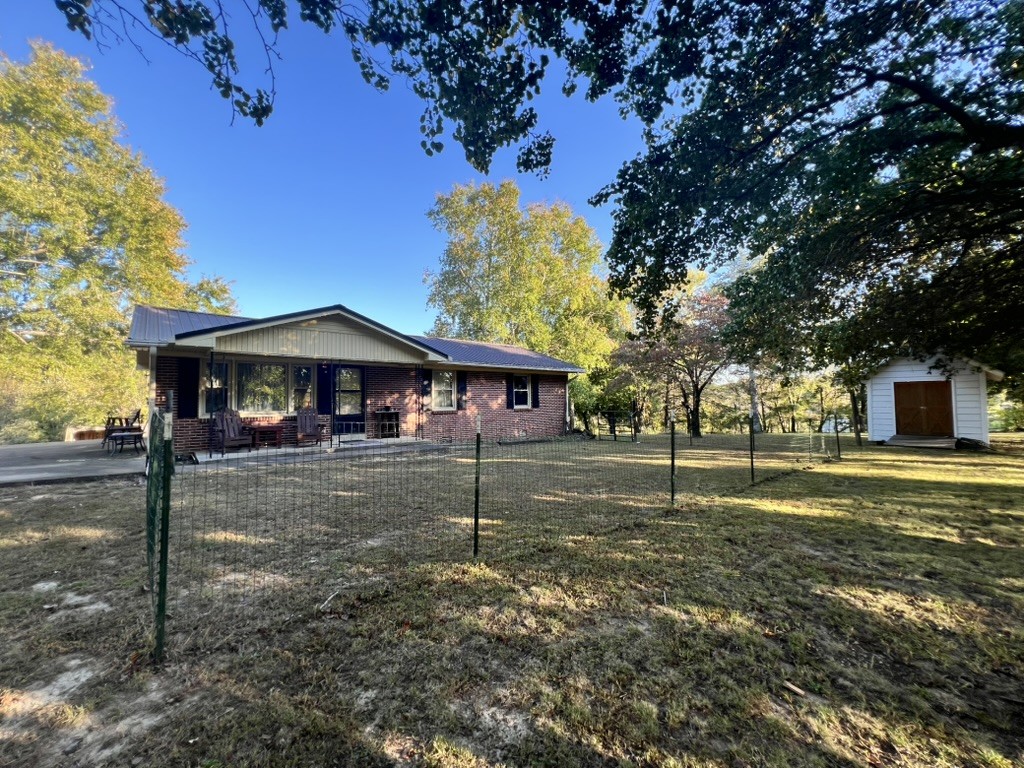 948 North Brace Road Summertown, TN 38483 - Photo 40 of 59 a front view of a house with a yard
