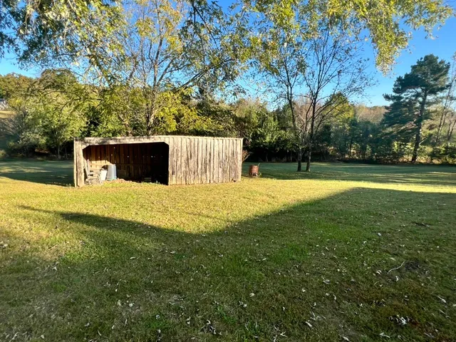 a view of field with tree s