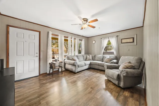 a kitchen with stainless steel appliances granite countertop a sink a stove and refrigerator
