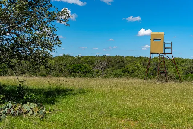 a view of a lake with a house in the background