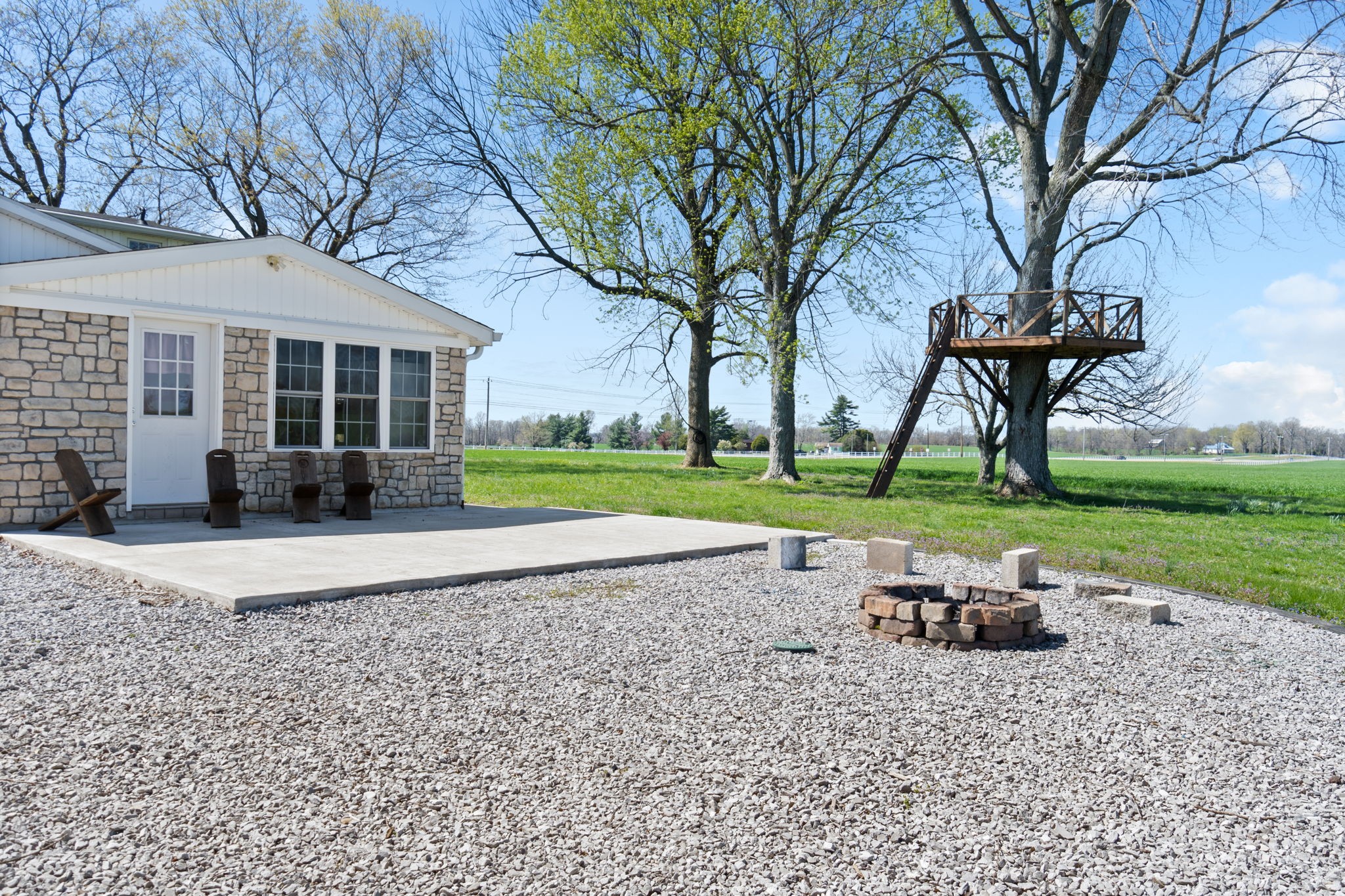 5150 Cadiz Road Hopkinsville, KY 42240 - Photo 38 of 45 a view of a house with backyard and a tree