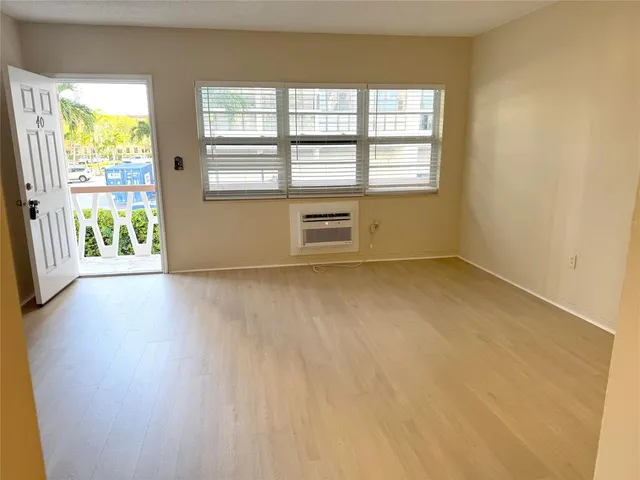 a view of an empty room with a window