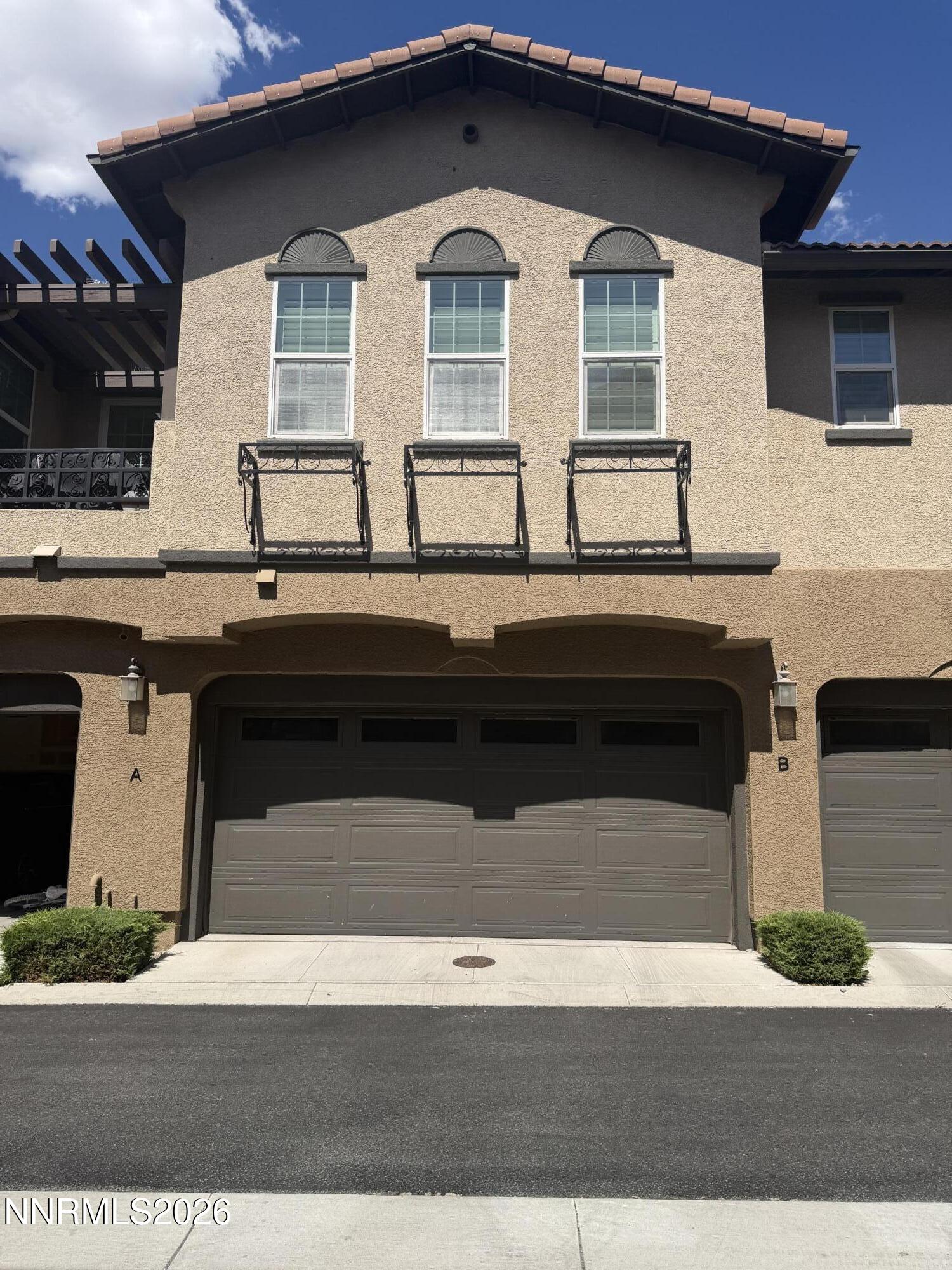 1892 Wind Ranch Road, Unit B Reno, NV 89521 - Photo 1 of 15 front garage 2