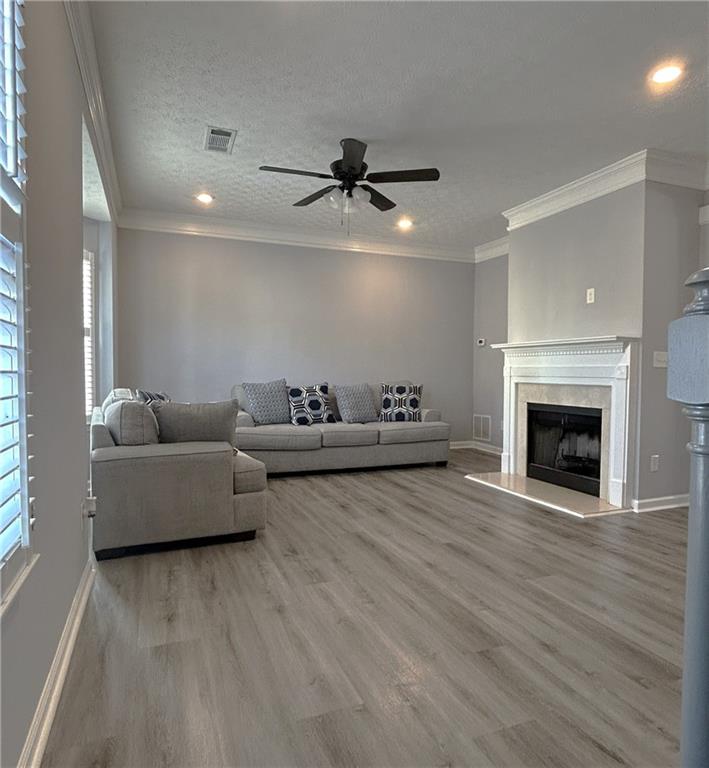 4711 Poplar Ridge Court Oakwood, GA 30566 - Photo 6 of 15 a living room with furniture and a fireplace