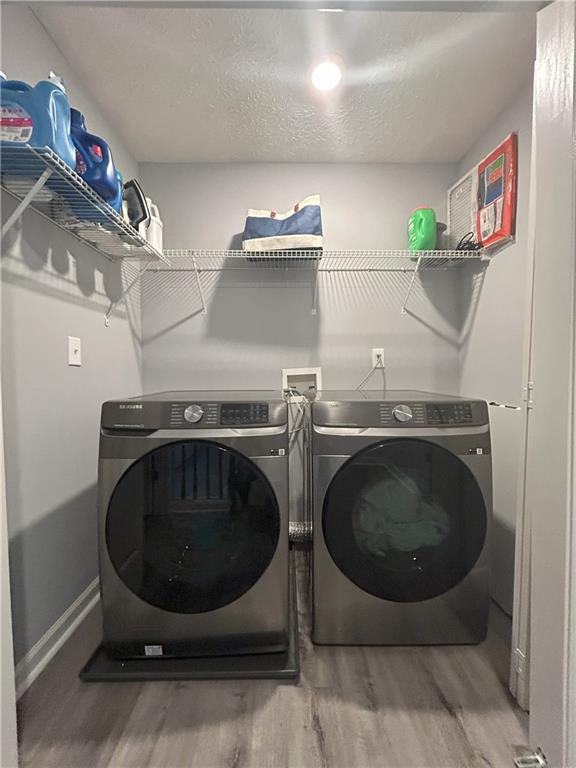 4711 Poplar Ridge Court Oakwood, GA 30566 - Photo 10 of 15 a utility room with dryer and washer