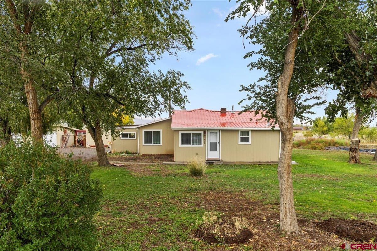 2410 6450th Road Montrose, CO 81401 - Photo 18 of 23 a house view with a garden space