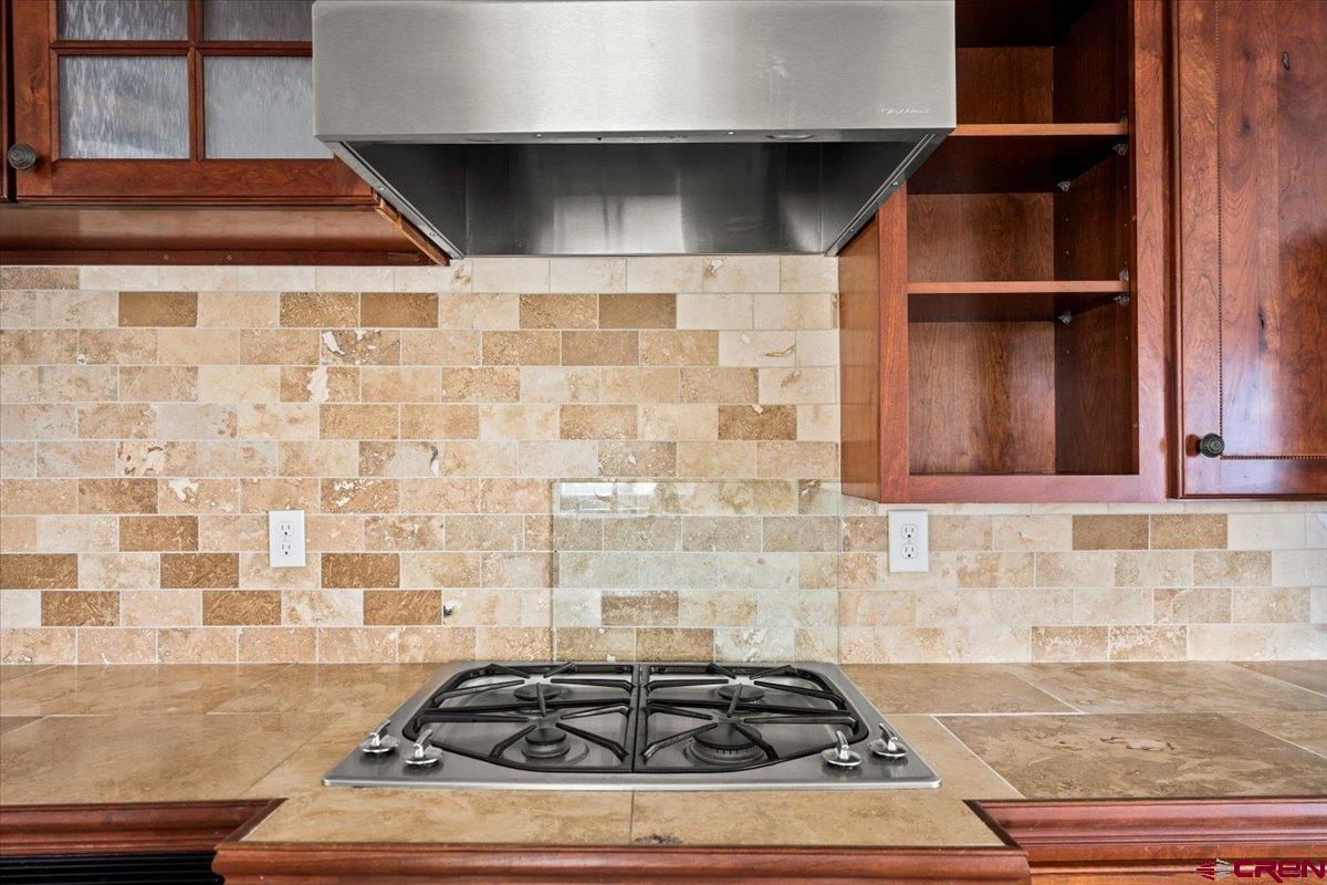 2410 6450th Road Montrose, CO 81401 - Photo 2 of 23 a stove top oven sitting inside of a kitchen