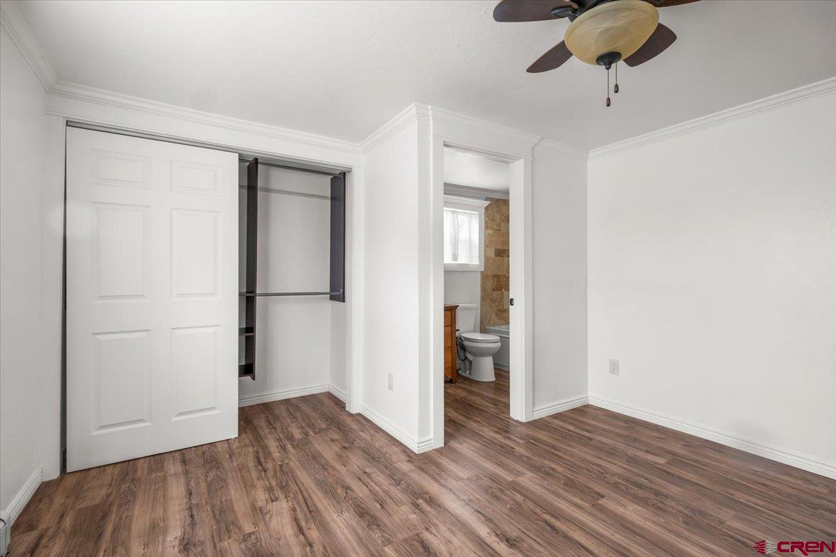 2410 6450th Road Montrose, CO 81401 - Photo 7 of 23 a view of empty room with wooden floor