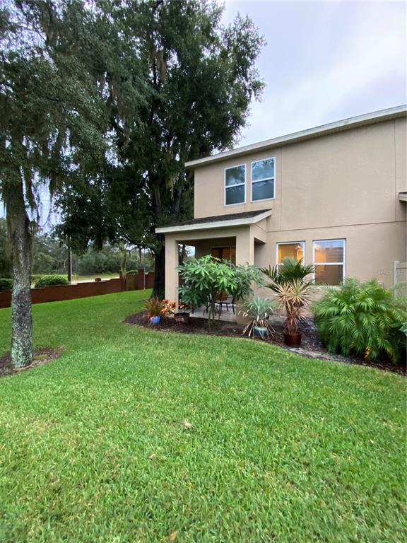 1772 Marsh Palm Parkway Ocoee, FL 34761 - Photo 11 of 29 a front view of house with yard and green space