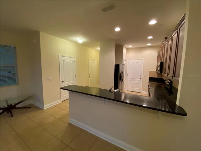 a bathroom with a sink a vanity and a mirror