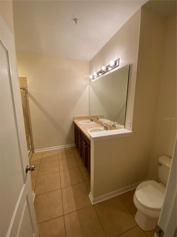 1772 Marsh Palm Parkway Ocoee, FL 34761 - Photo 20 of 29 a bathroom with a sink a toilet and a mirror