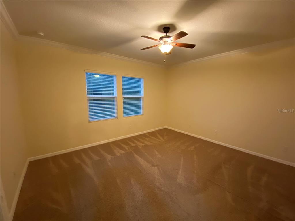 1772 Marsh Palm Parkway Ocoee, FL 34761 - Photo 24 of 29 a view of an empty room with a chandelier fan