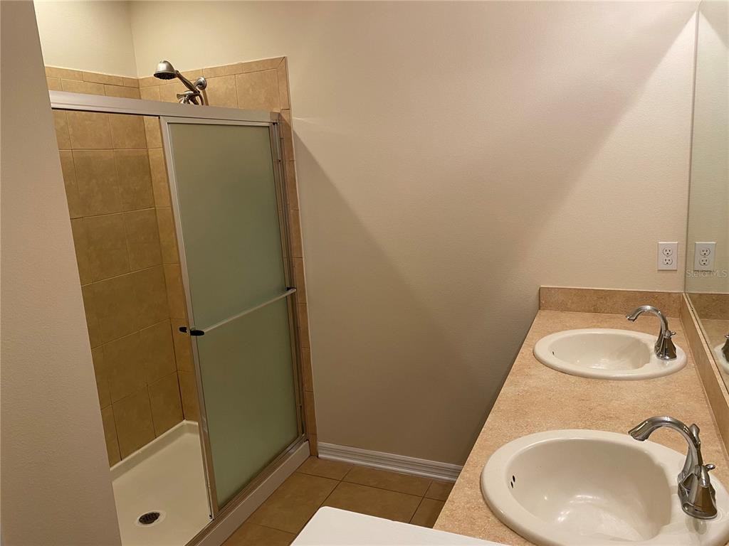 1772 Marsh Palm Parkway Ocoee, FL 34761 - Photo 25 of 29 a bathroom with a sink and a vanity