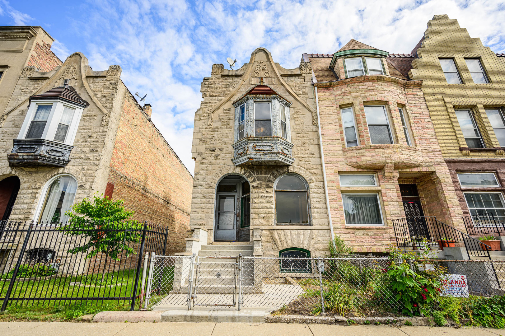 430 East 46th Street Chicago, IL 60653 - Photo 1 of 15 a front view of a residential apartment building with a yard