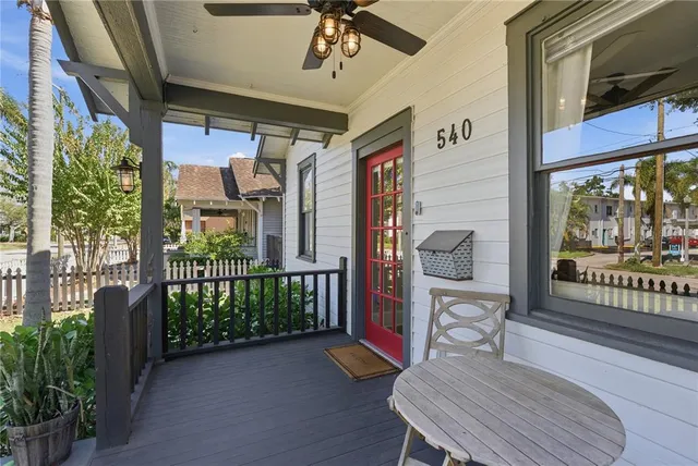 a balcony view with a seating space