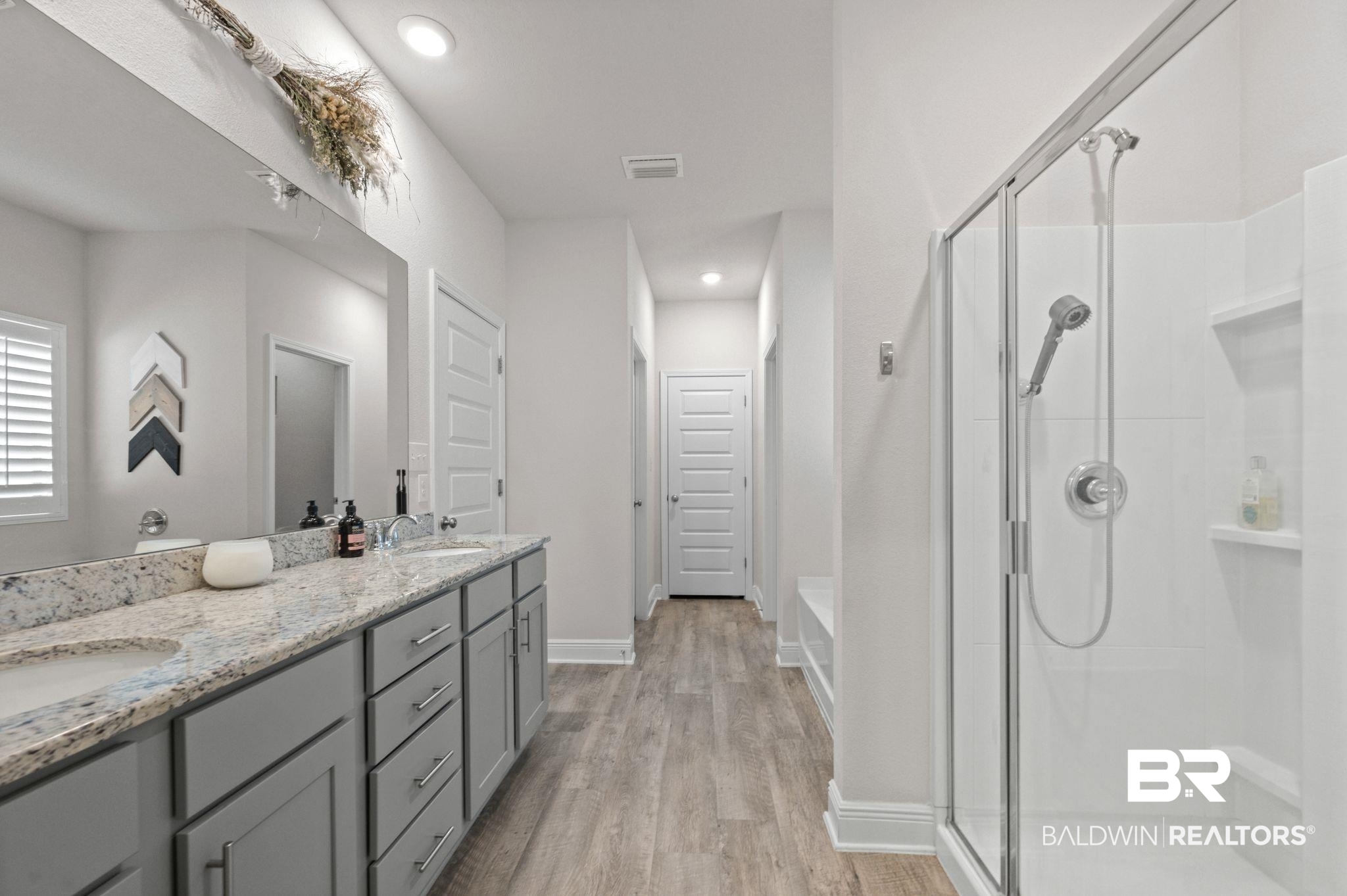 24891 Spectacular Bid Loop Daphne, AL 36526 - Photo 34 of 51 Bathroom with hardwood / wood-style flooring, vanity, and walk in shower