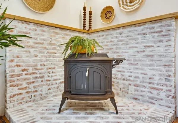 a kitchen with stainless steel appliances granite countertop a sink dishwasher stove and refrigerator with wooden floor