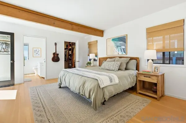 a bedroom with furniture and a window