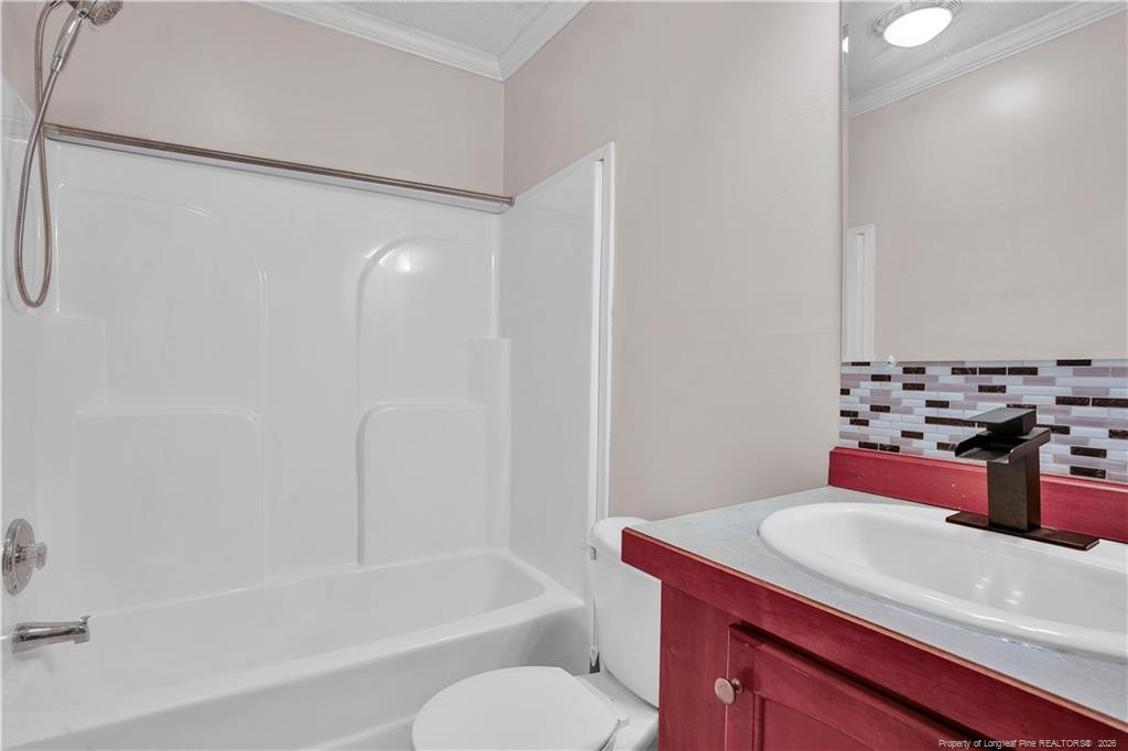 8155 Arabia Road Lumber Bridge, NC 28357 - Photo 17 of 30 a bathroom with a tub sink mirror and toilet