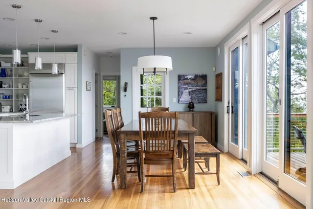 a kitchen with stainless steel appliances granite countertop a sink and wooden cabinets