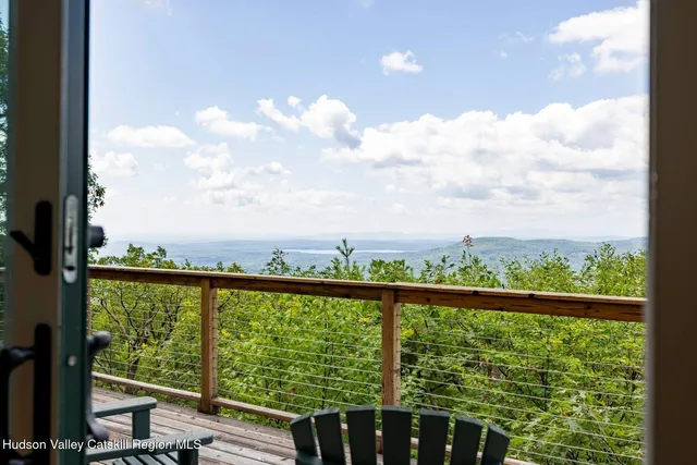 a view of a room with furniture and a window