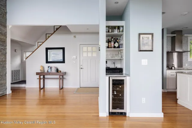 a bedroom with furniture and a large window