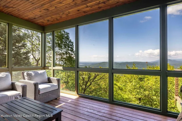 a bedroom with a bed and a book shelf