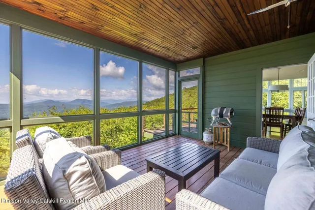a bedroom with a large bed and a large window