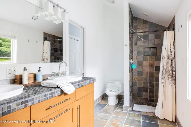 a view of a backyard with plants and a patio