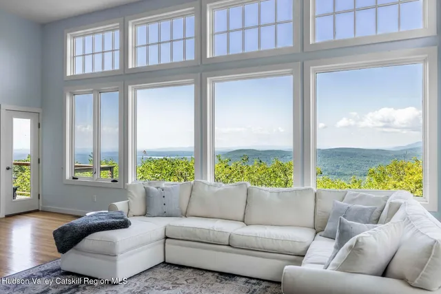 a bed room with a bed and a large window