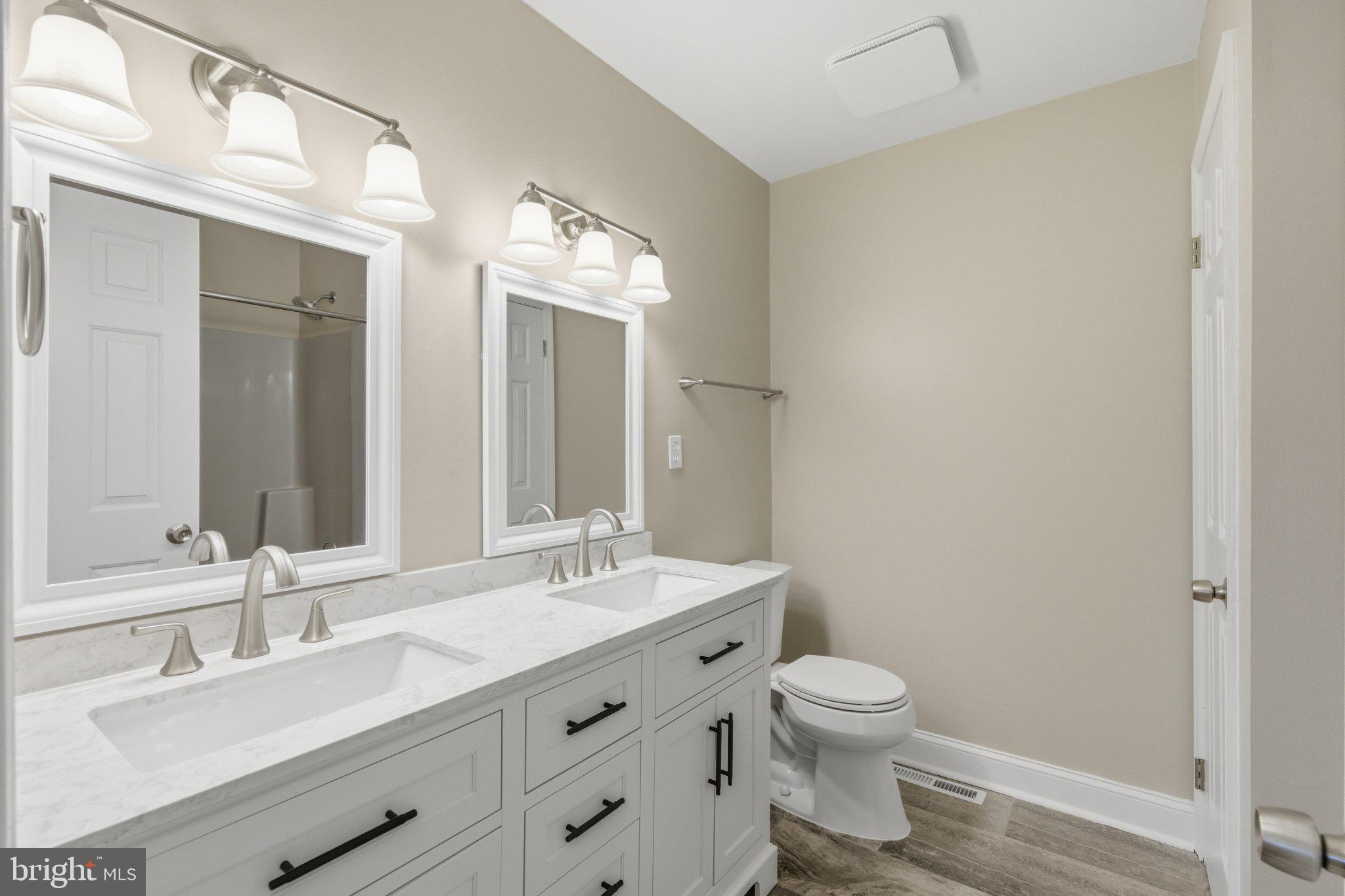 18310 Upper Beckleysville Road Hampstead, MD 21074 - Photo 30 of 67 Sleek modern bathroom with dual sinks.