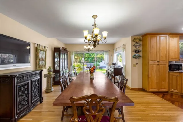 a bathroom with a toilet a sink a tub and mirror