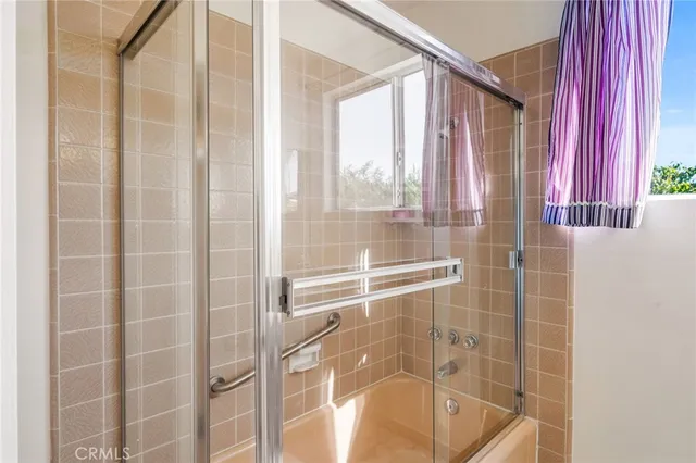 a bedroom with furniture and flat screen tv