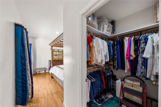 a view of a workspace with furniture and wooden floor