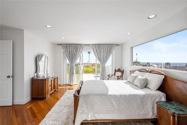 a living room with furniture a rug and a flat screen tv