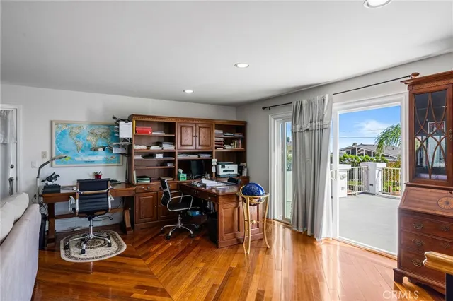 a front view of a house with swimming pool having outdoor seating