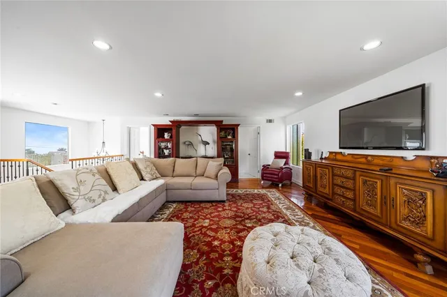 a front view of a house with a yard and a garden