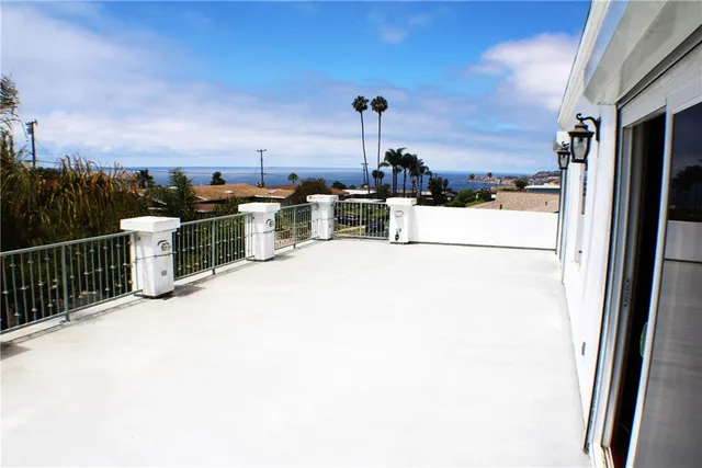 an aerial view of multiple house with a yard