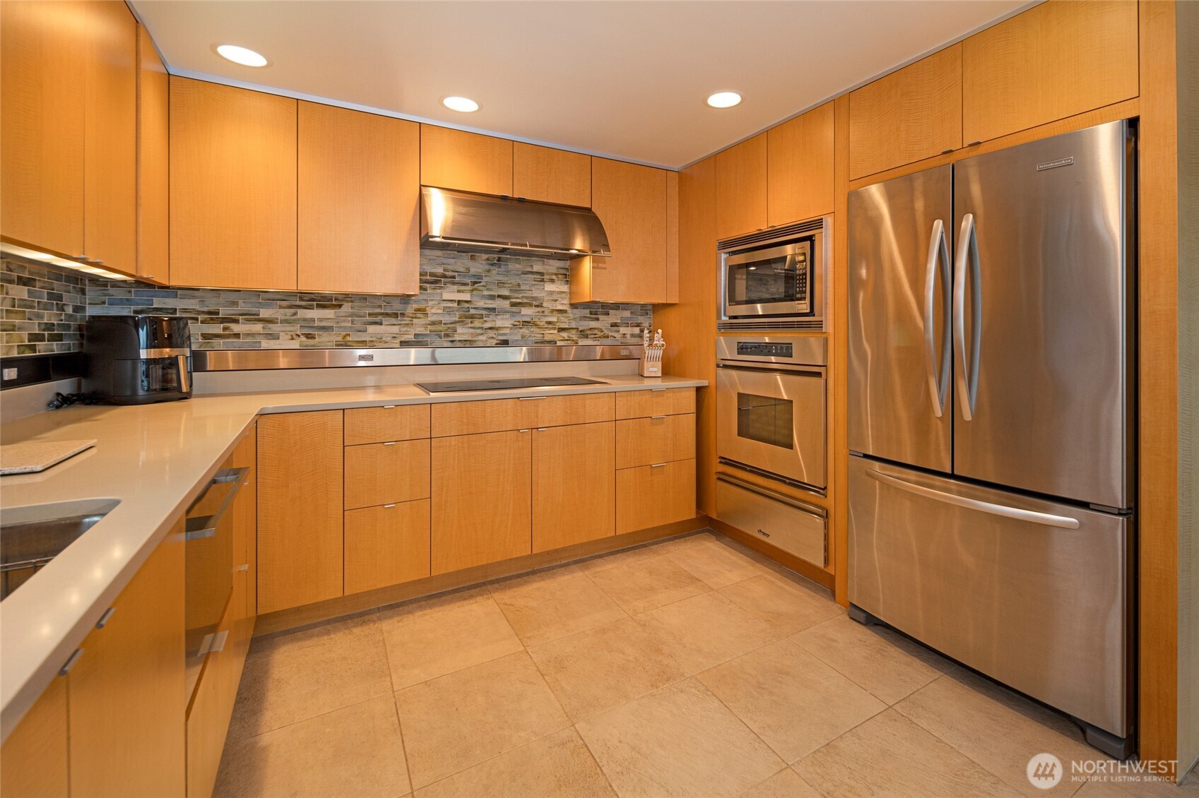 2623 Pear Point Road Friday Harbor, WA 98250 - Photo 16 of 40 a kitchen with stainless steel appliances granite countertop a refrigerator a sink and a stove