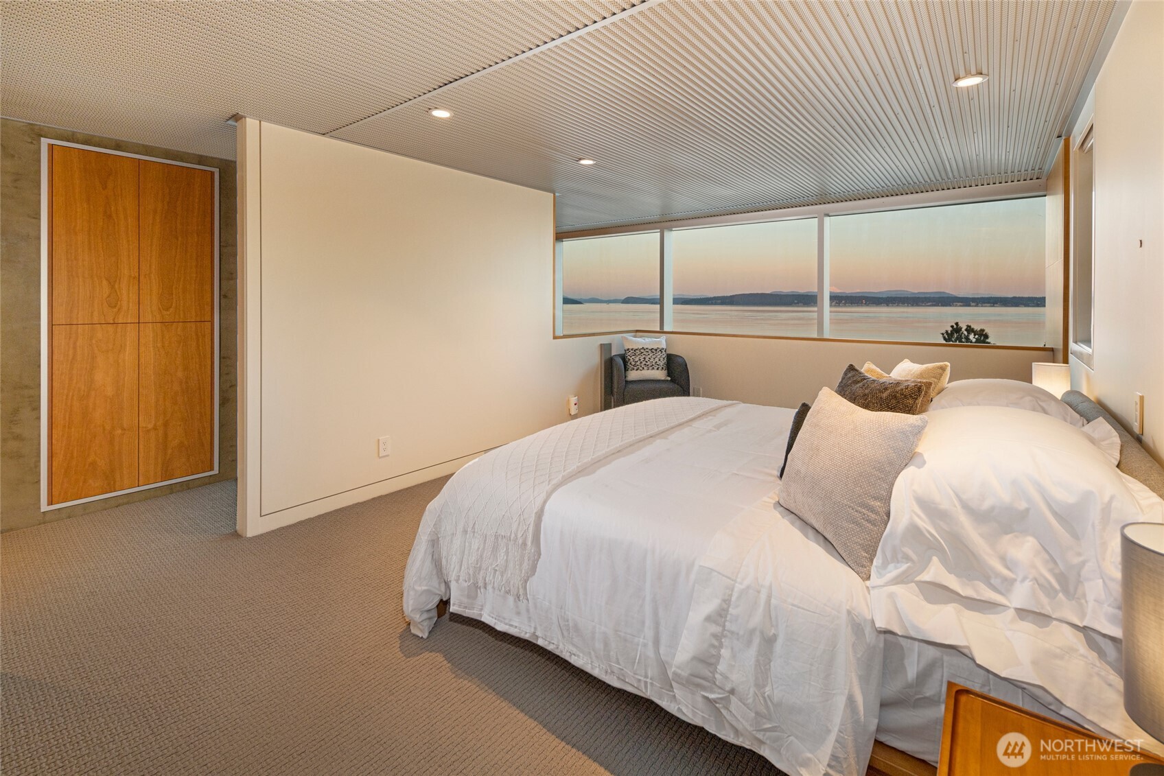 2623 Pear Point Road Friday Harbor, WA 98250 - Photo 26 of 40 a bedroom with a bed and large window