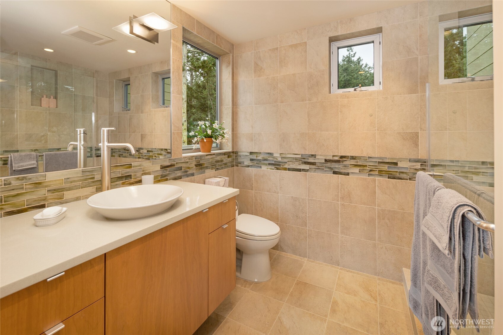 2623 Pear Point Road Friday Harbor, WA 98250 - Photo 27 of 40 a bathroom with a sink a toilet and a mirror