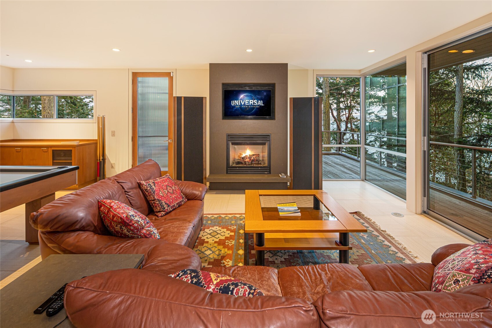 2623 Pear Point Road Friday Harbor, WA 98250 - Photo 29 of 40 a living room with furniture and a fireplace