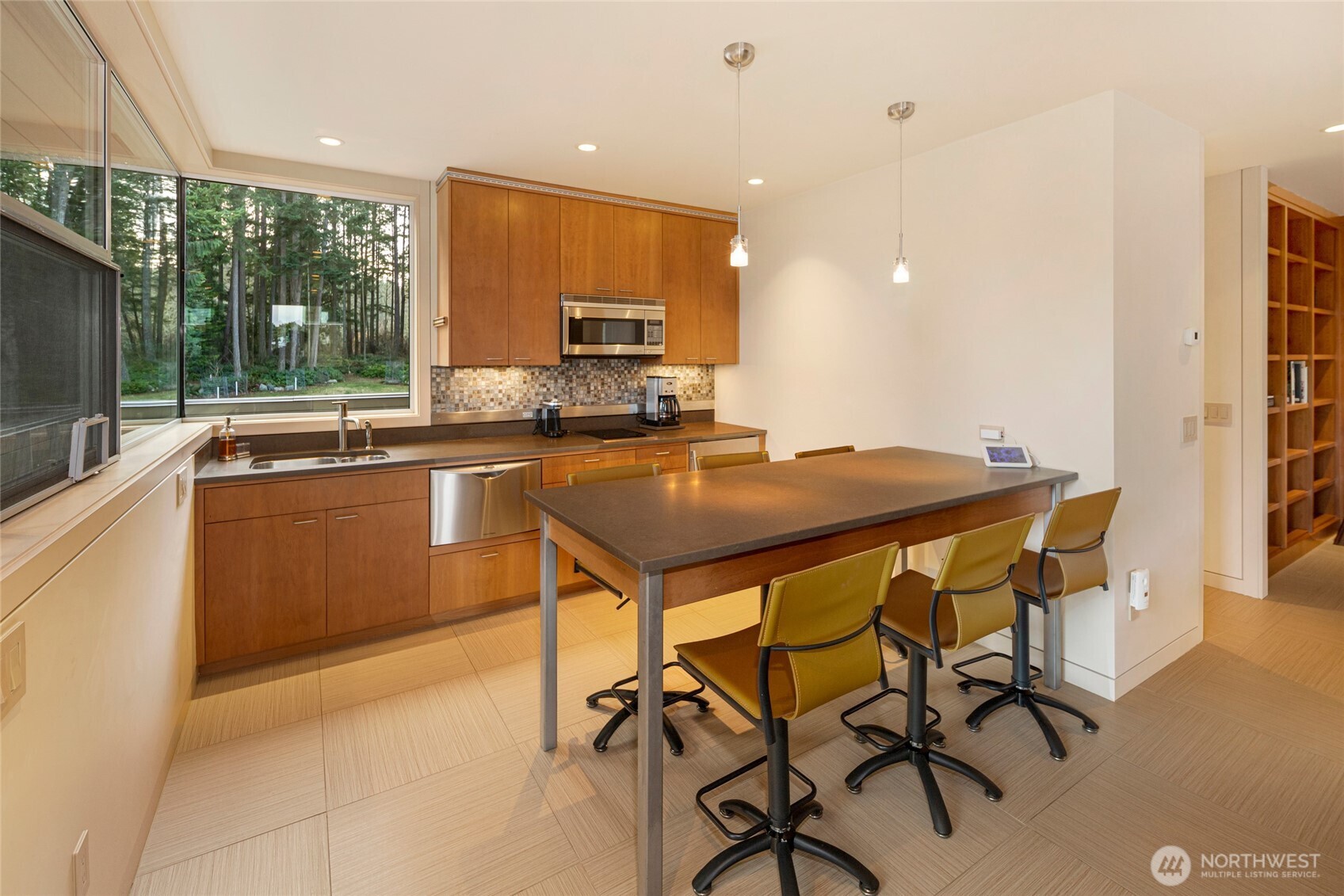 2623 Pear Point Road Friday Harbor, WA 98250 - Photo 31 of 40 a kitchen with a table chairs sink and cabinets