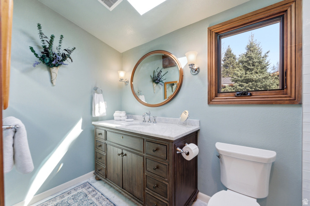 2635 Little Kate Road, Unit 21 Park City, UT 84060 - Photo 28 of 39 Bathroom featuring vanity, vaulted ceiling, and a skylight