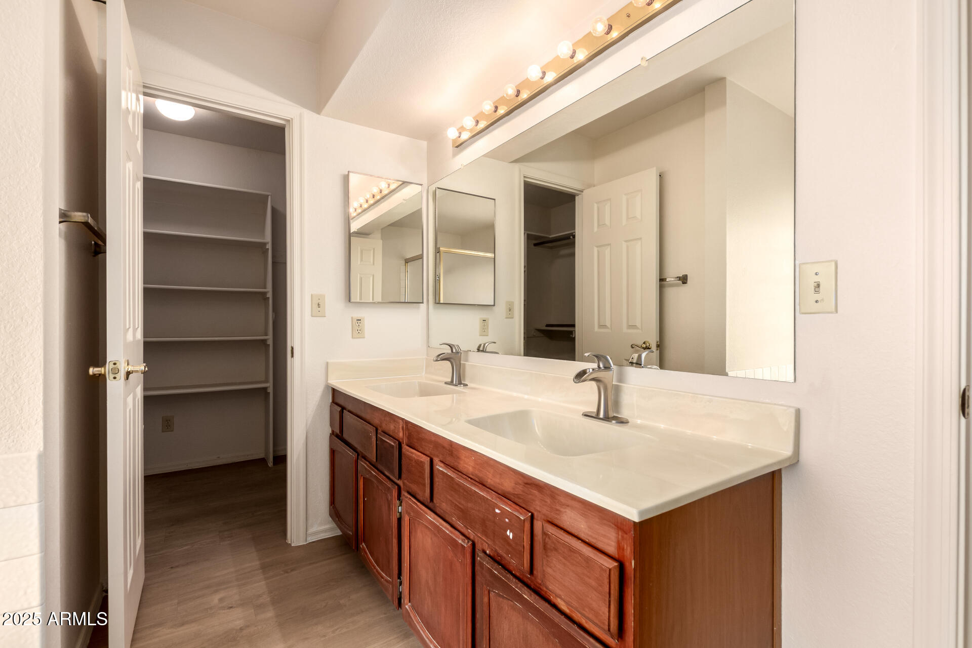 2059 East Brown Road, Unit 30 Mesa, AZ 85213 - Photo 11 of 24 a bathroom with a sink and a mirror