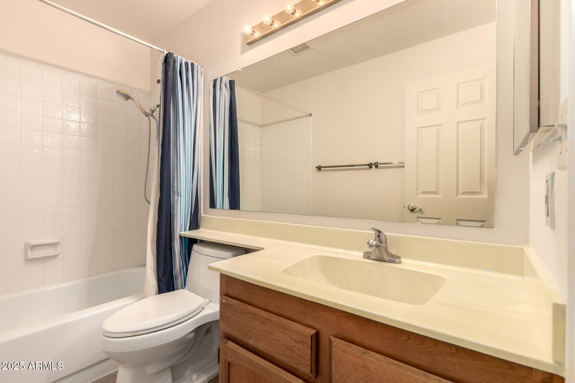 2059 East Brown Road, Unit 30 Mesa, AZ 85213 - Photo 15 of 24 a bathroom with a sink toilet and shower